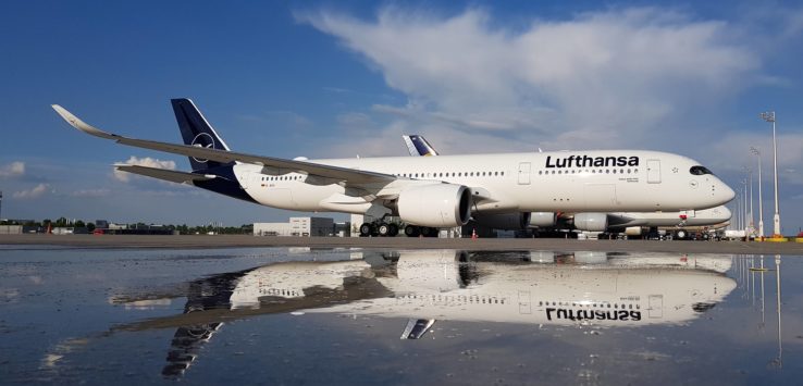 a large white airplane on a tarmac