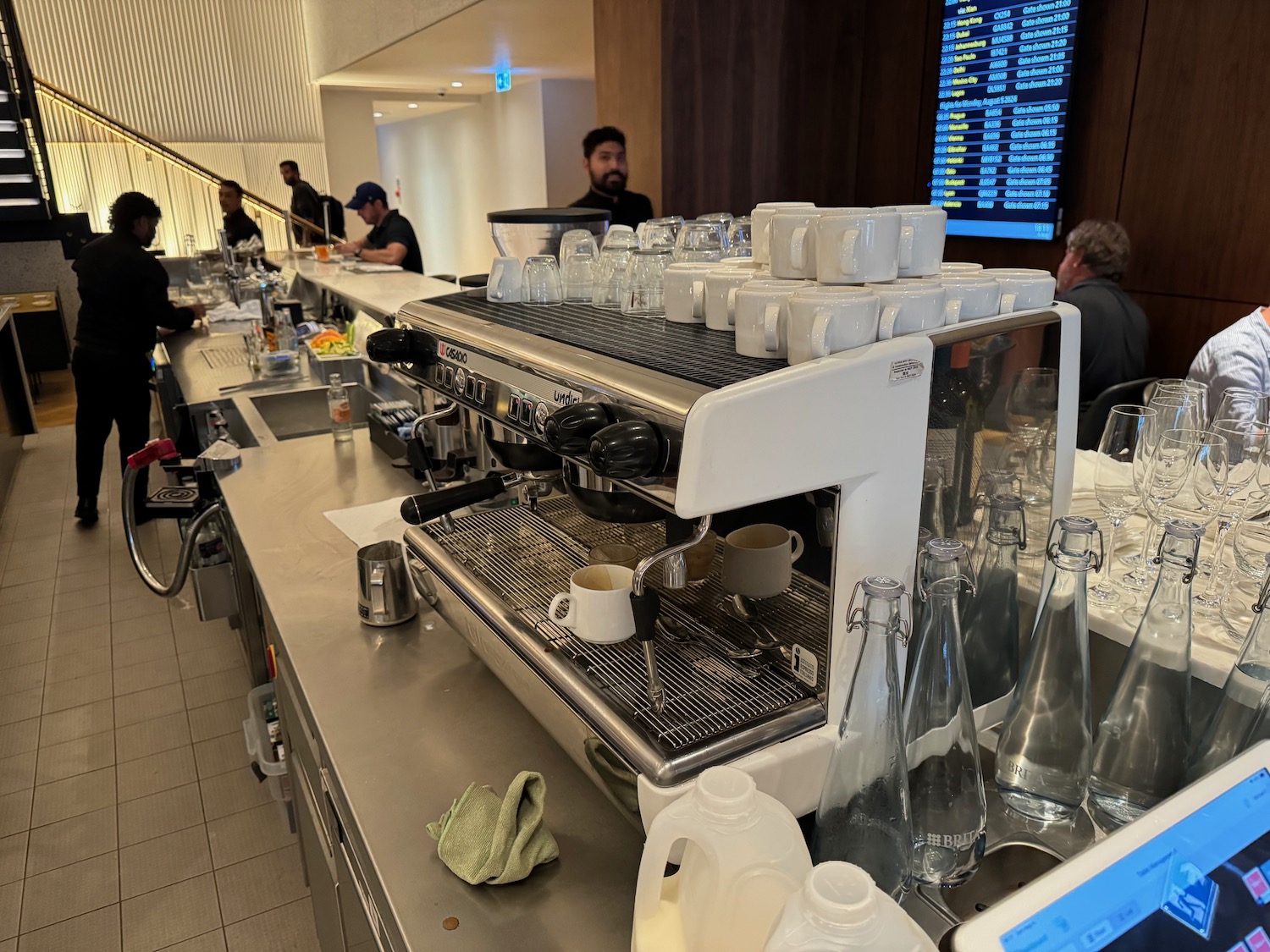 a coffee machine with cups on top of it