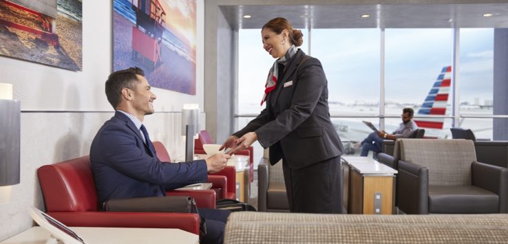 a woman shaking hands with a man