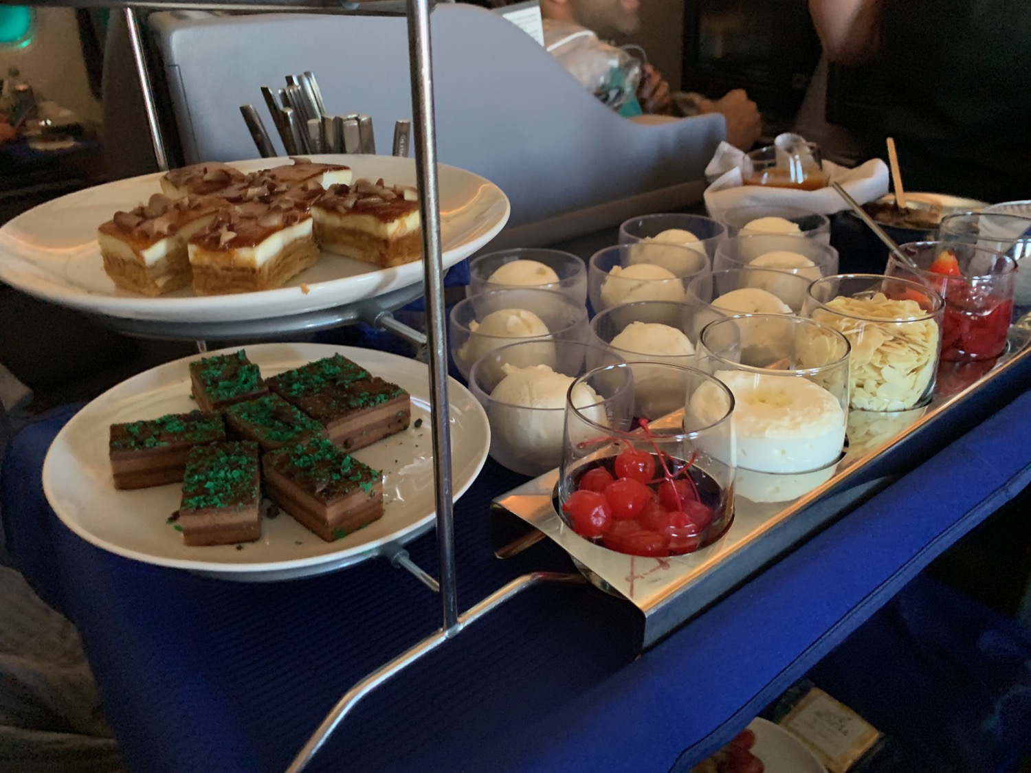 a tray of desserts and dessert cups