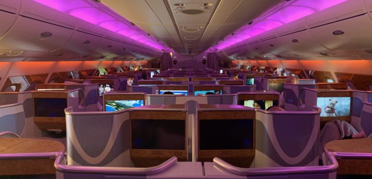 an airplane with purple lights
