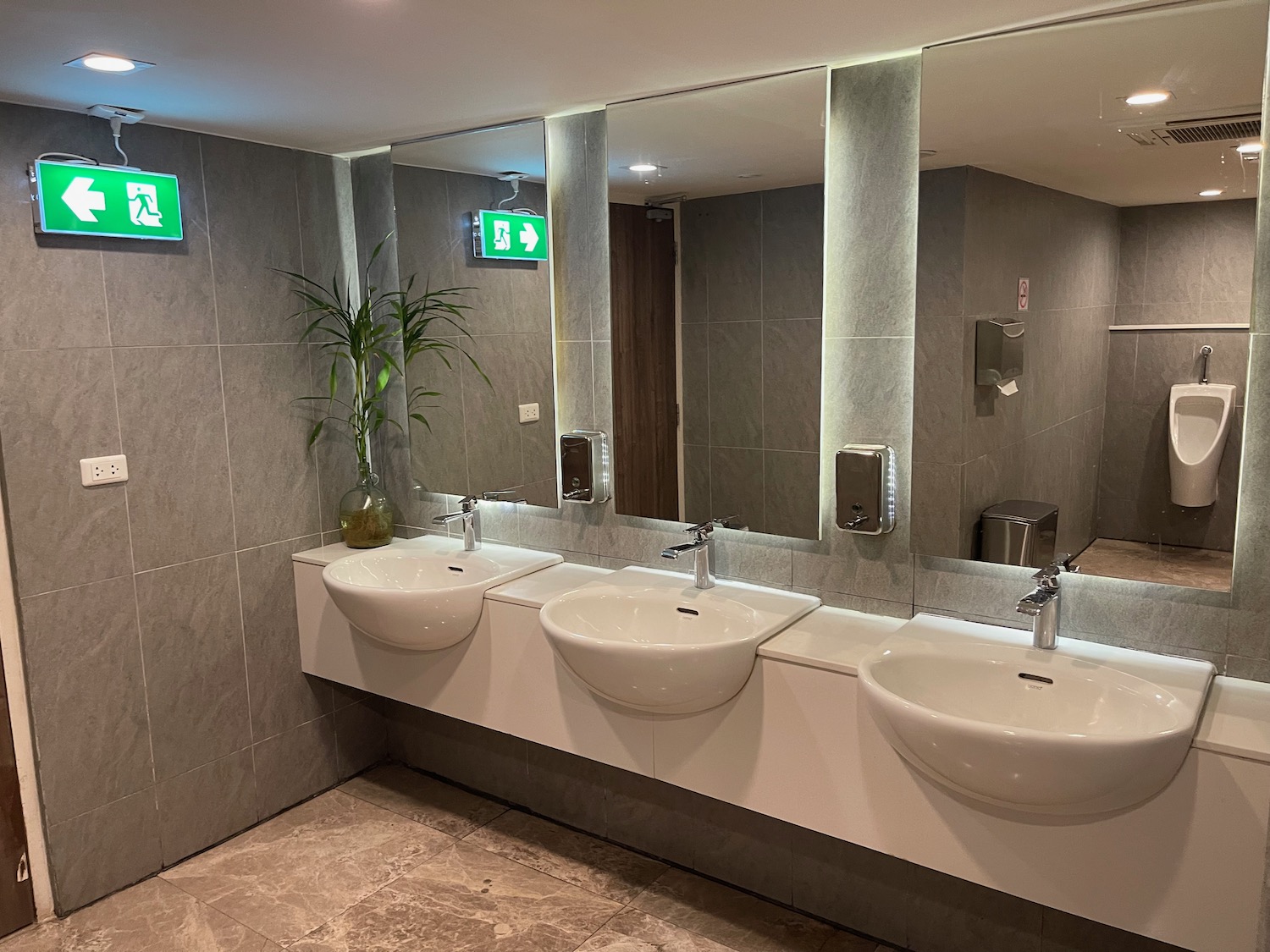 a bathroom with sinks and a mirror