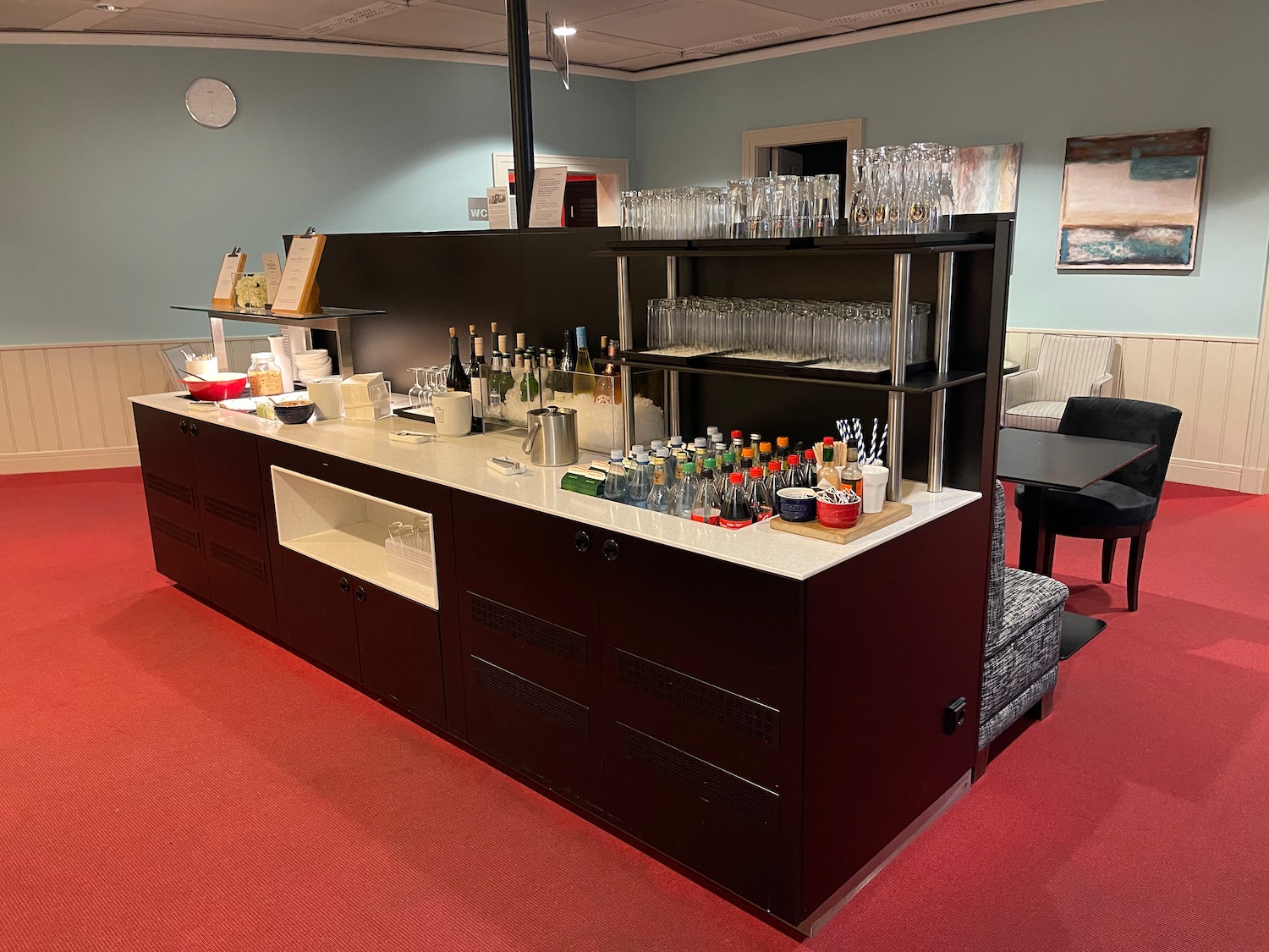 a bar with drinks on the counter