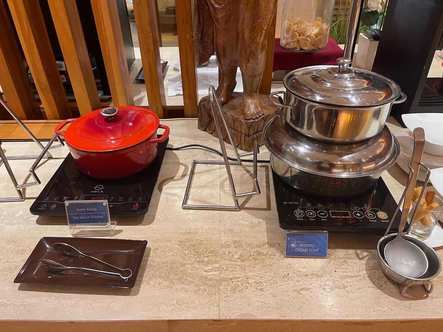 a kitchen counter with pots and pans