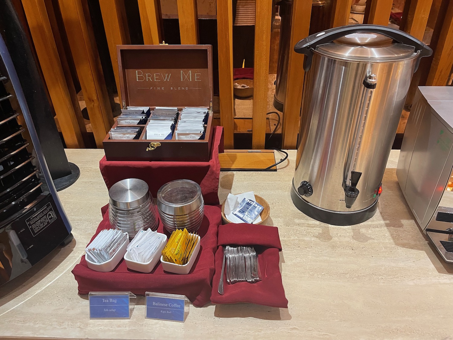 a table with a container of sugar and sugar packets