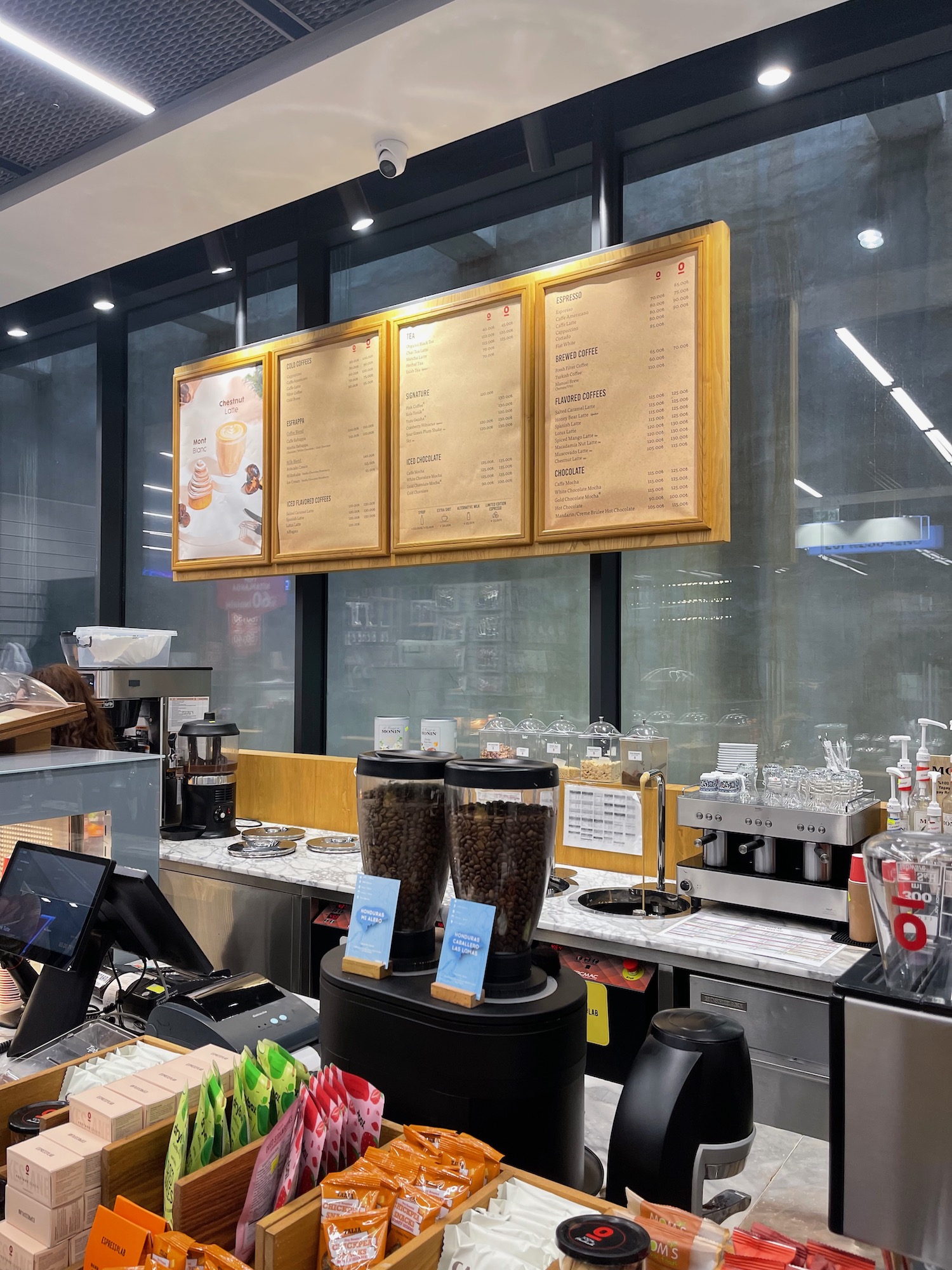 a coffee shop with menus and coffee beans