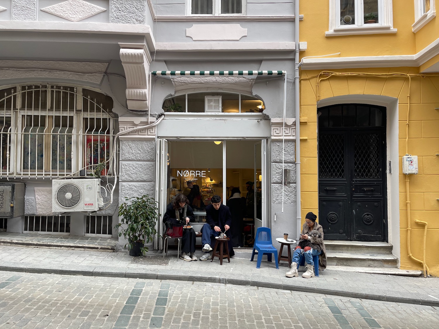 people sitting outside a store