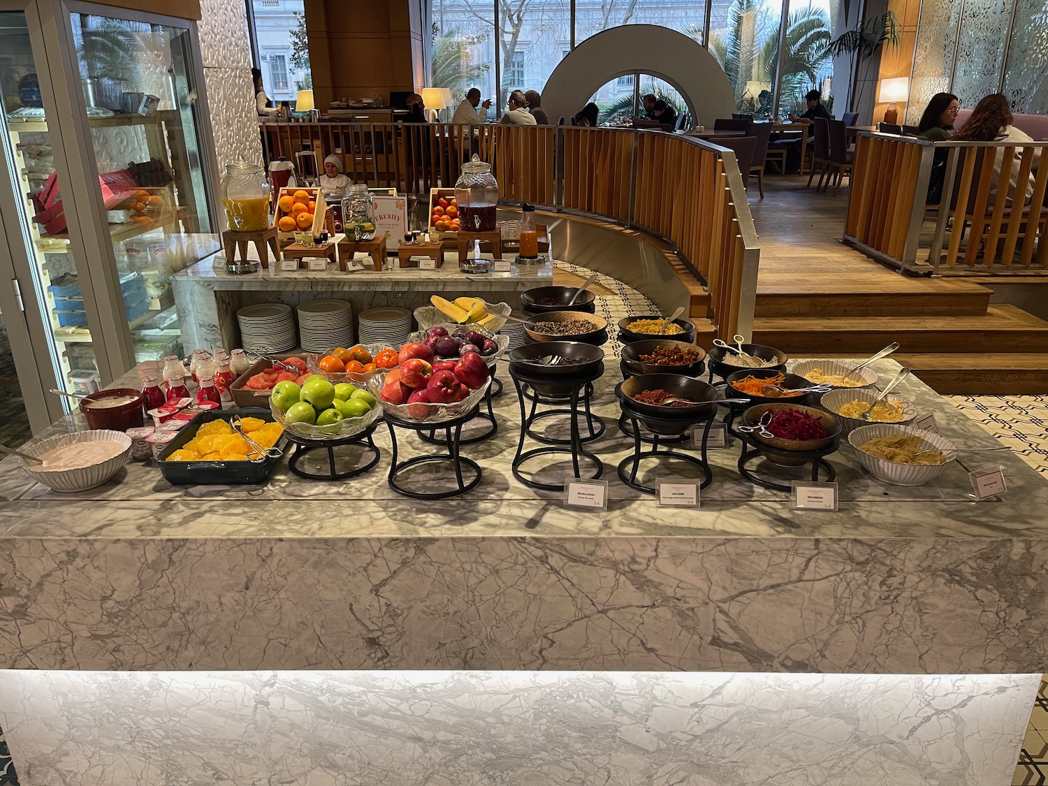a buffet with fruit and food on it