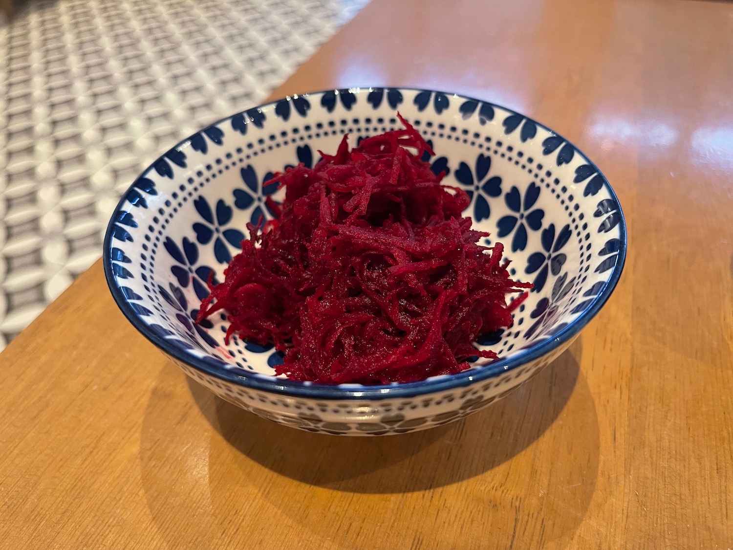 a bowl of shredded red food