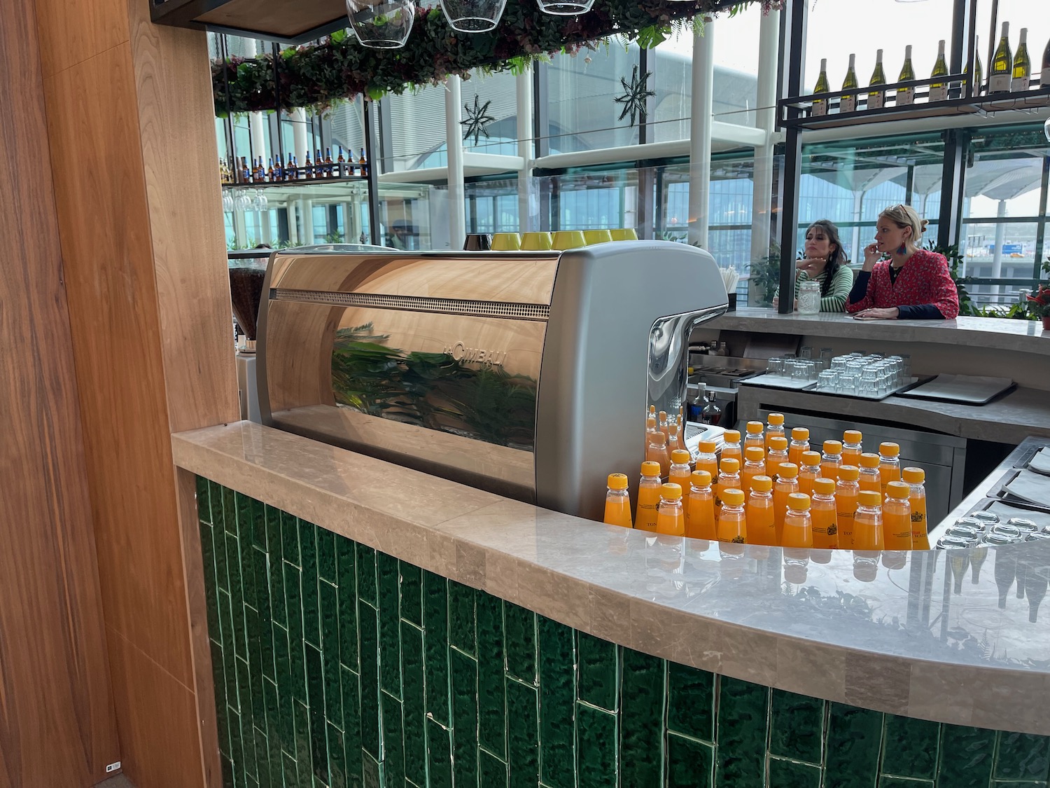 a counter with bottles of orange juice