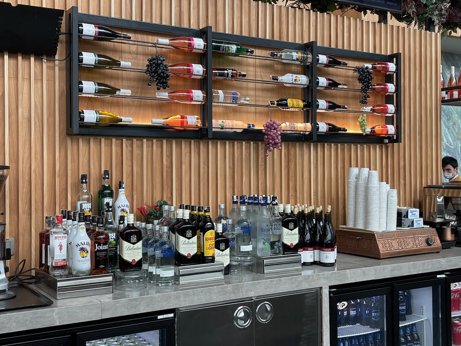 a bar with bottles of alcohol on the wall