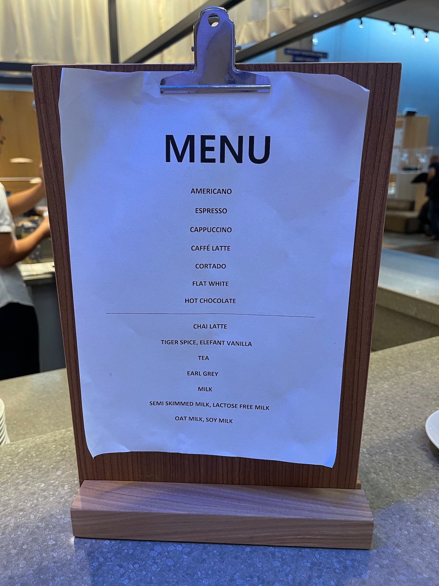 a menu on a wood stand