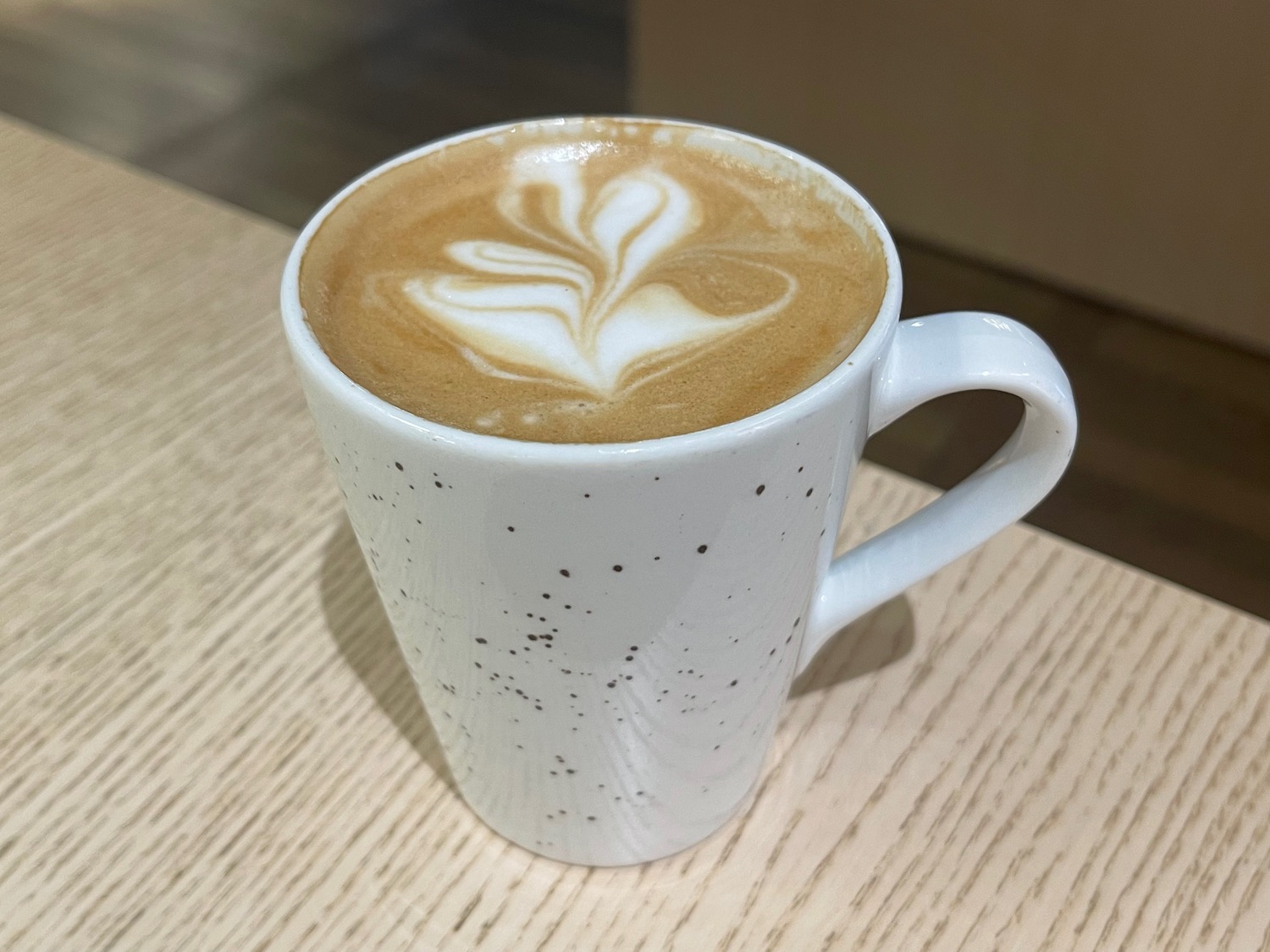 a coffee in a white mug