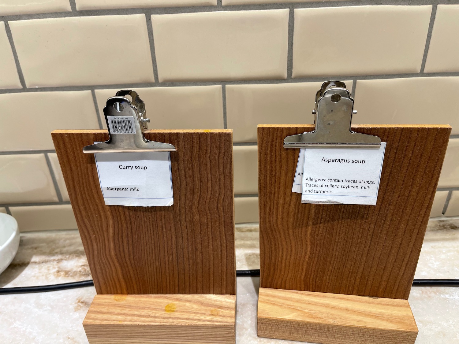 a pair of wood boards with paper clips