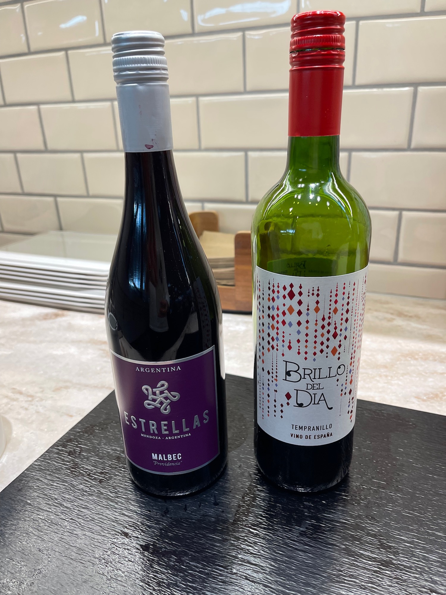 a couple of wine bottles on a counter