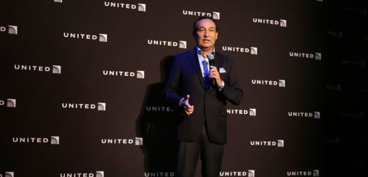 a man in a suit holding a microphone