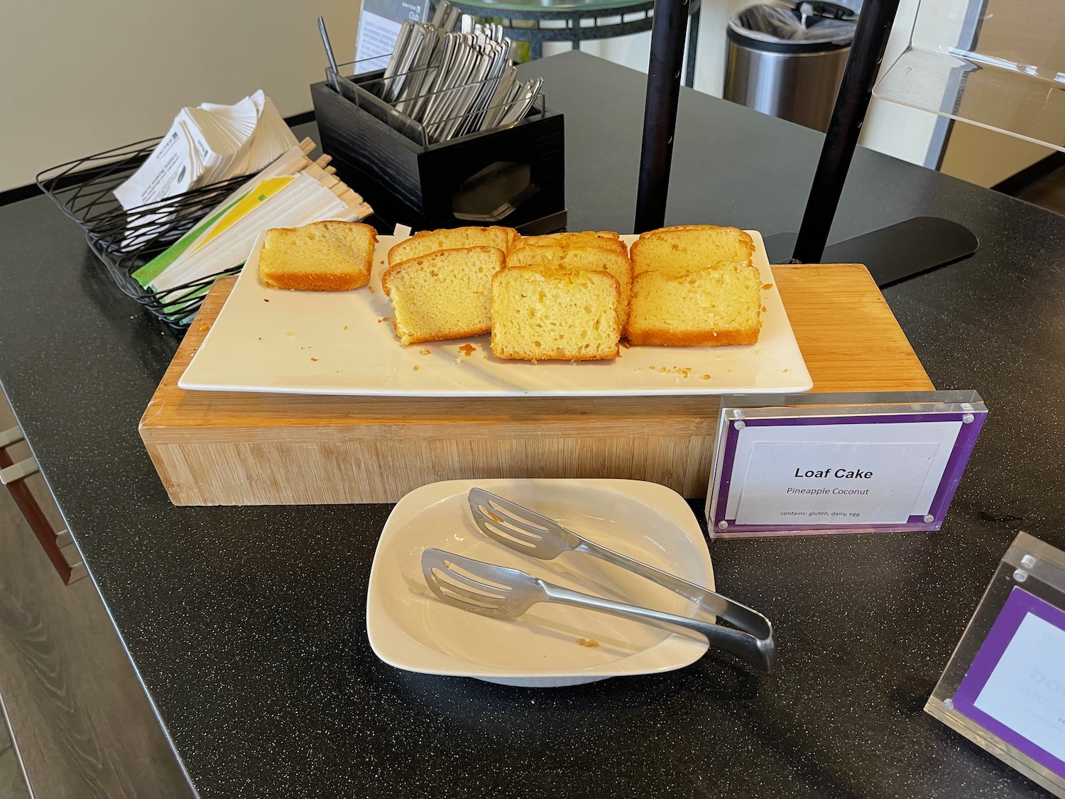 a plate of cake and forks on a table