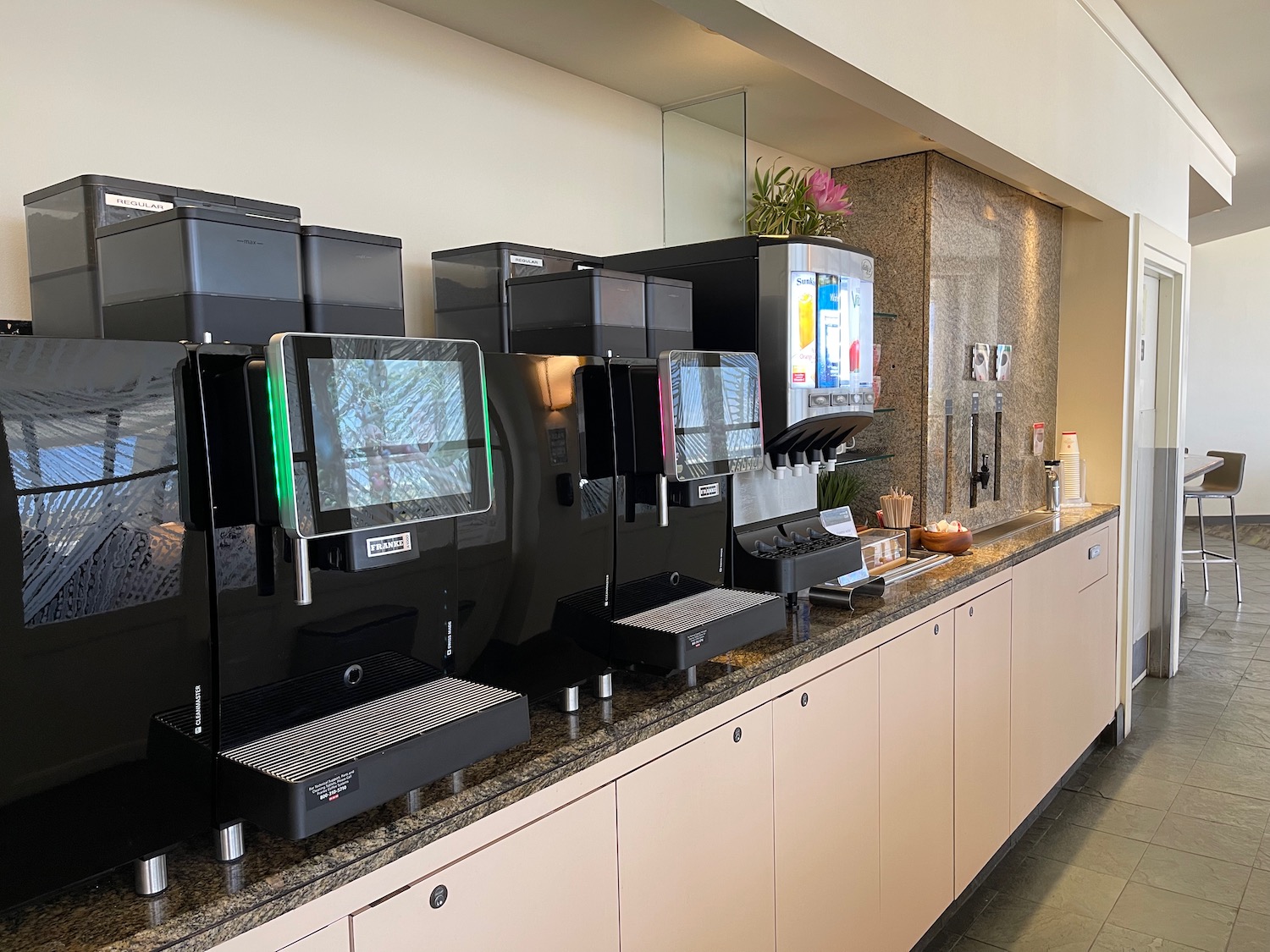 a group of coffee machines on a counter