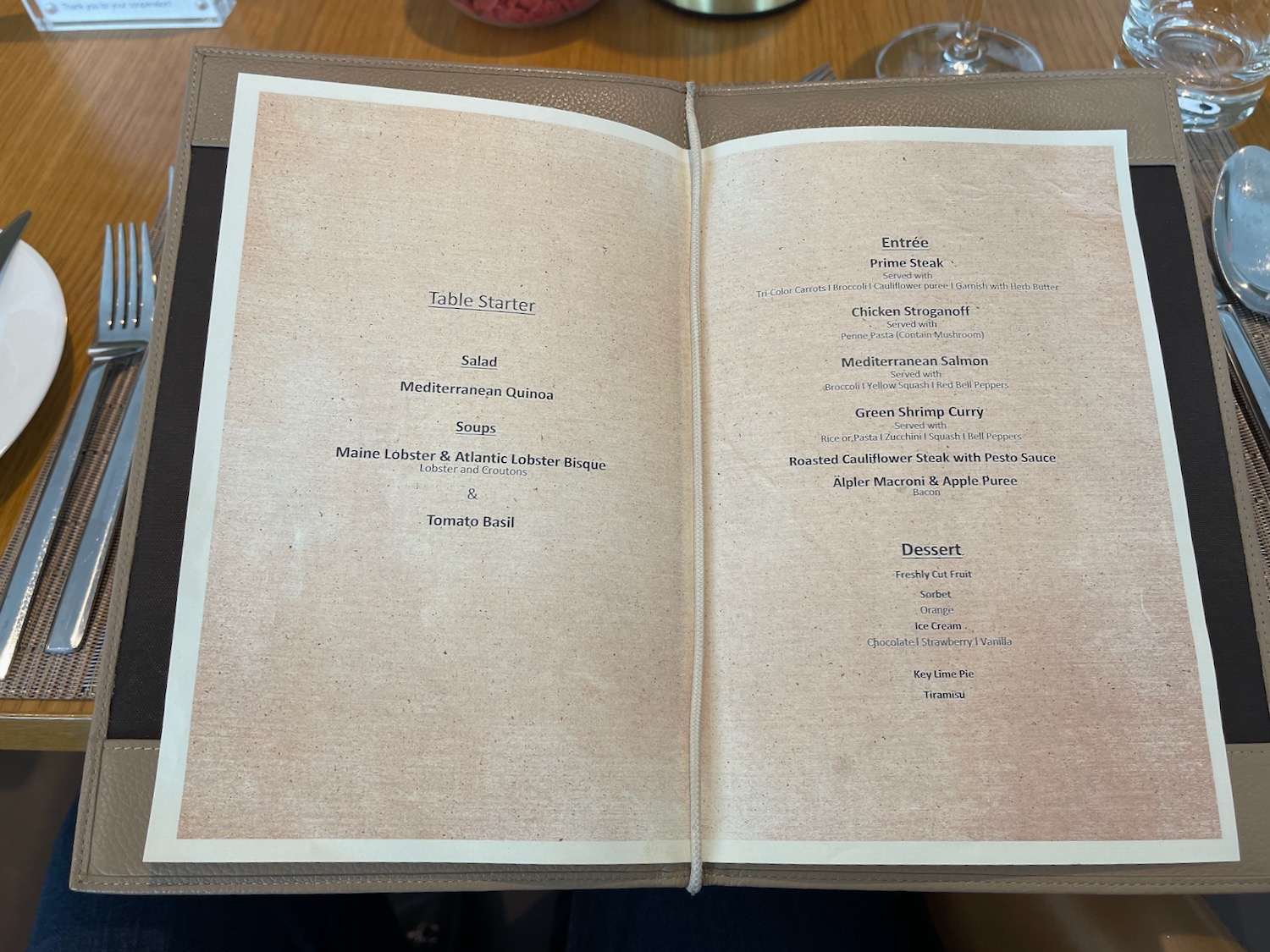 a menu book with black text