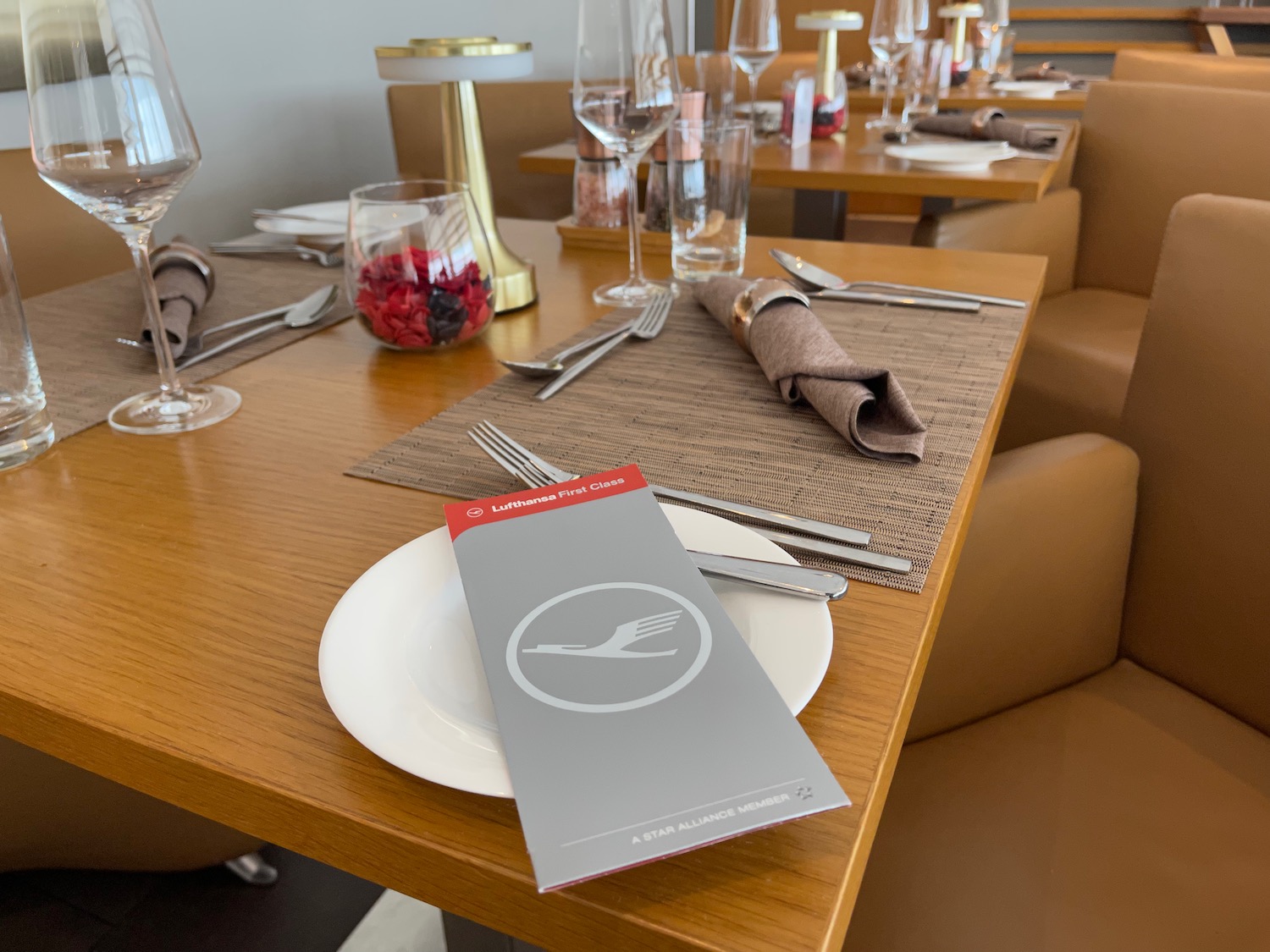 a table with a menu and glasses on it