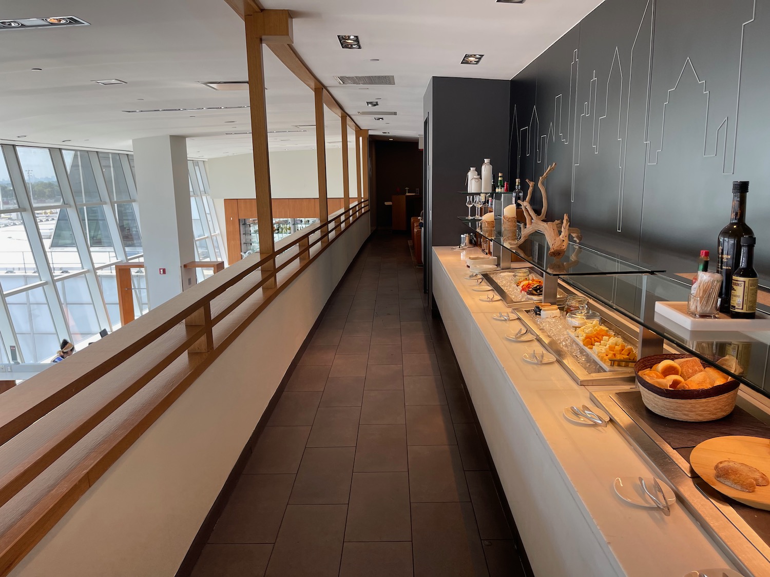 a long hallway with a row of food on the counter