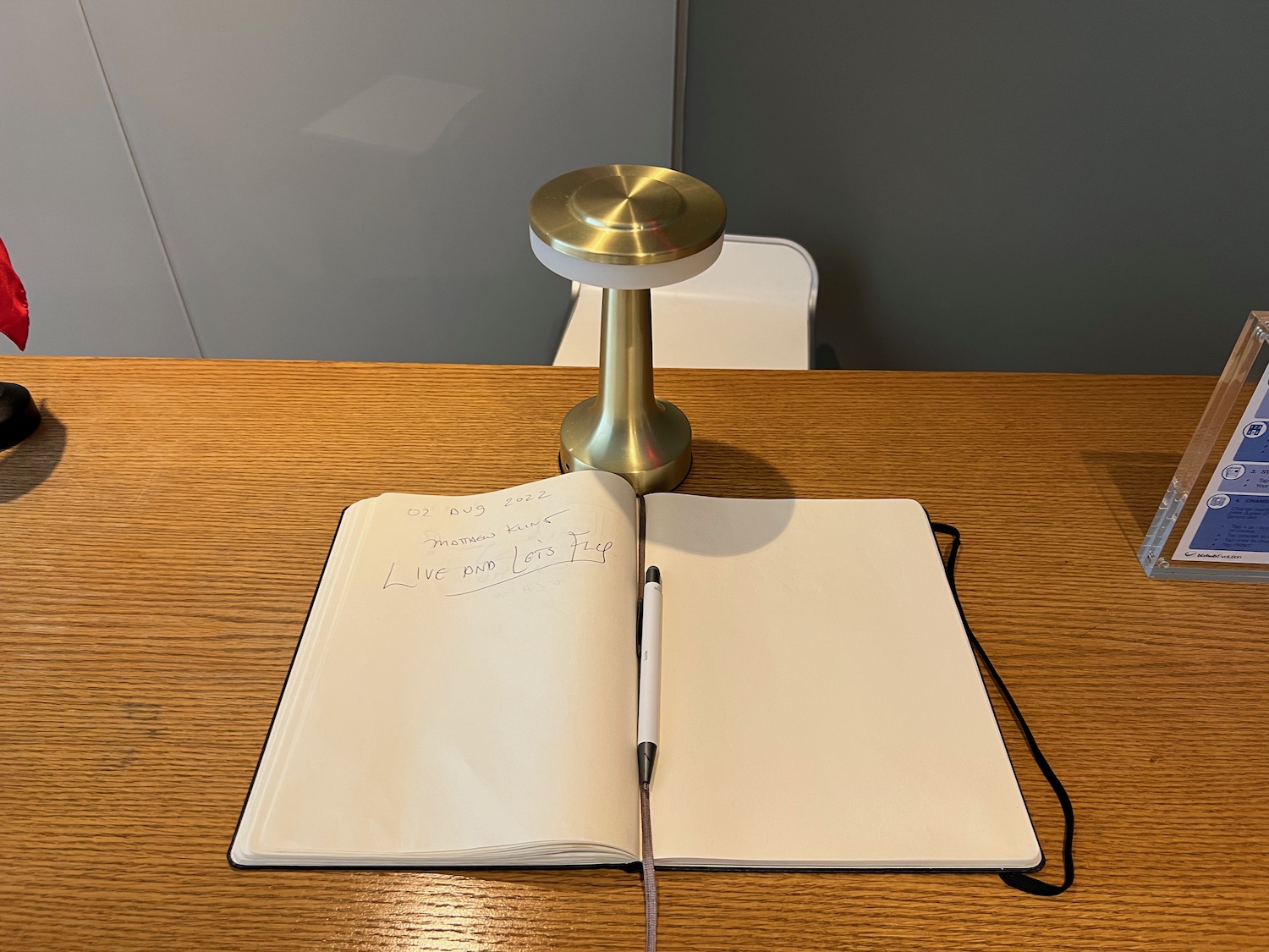 a book and a lamp on a table