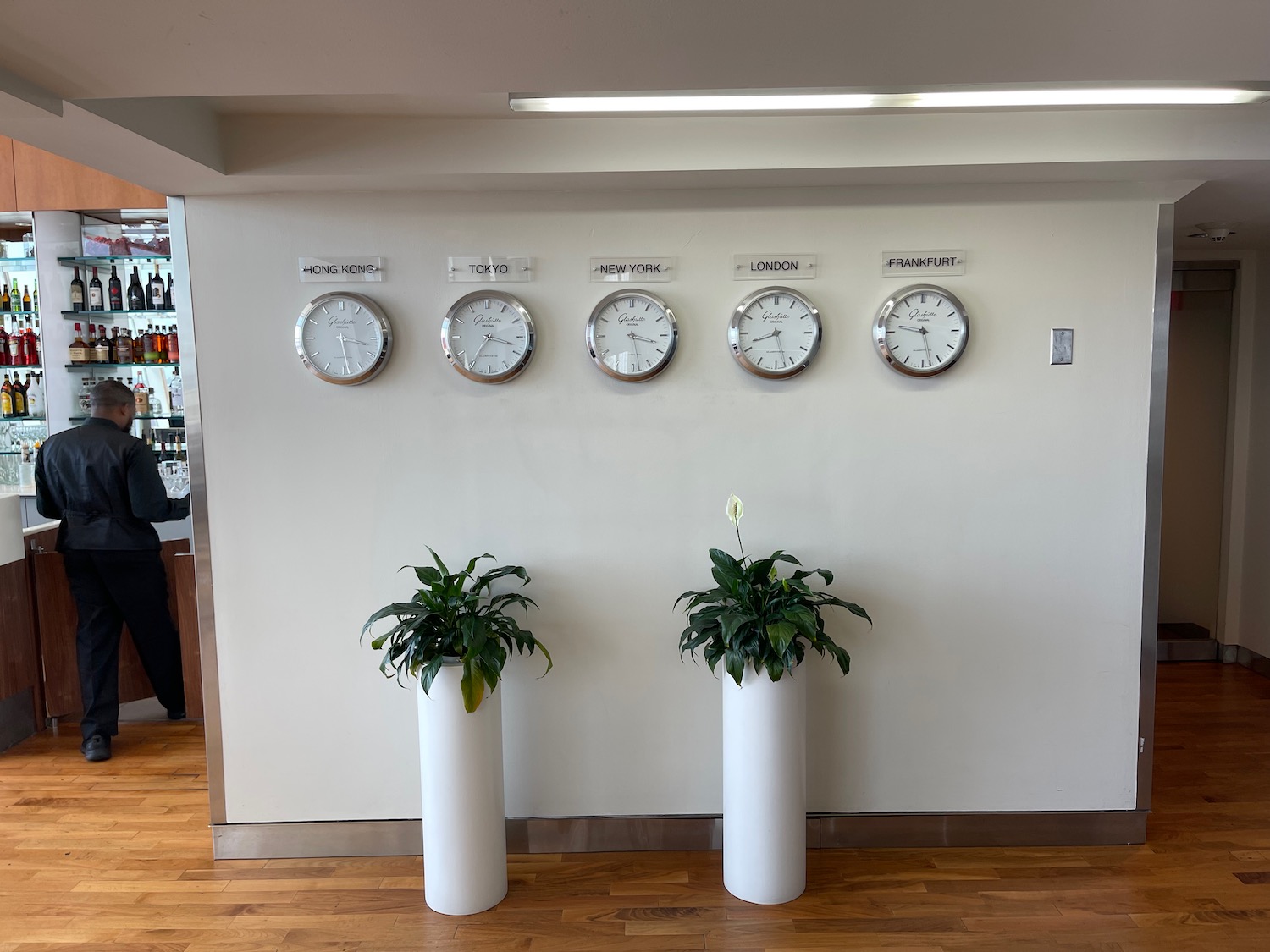 a group of clocks on a wall