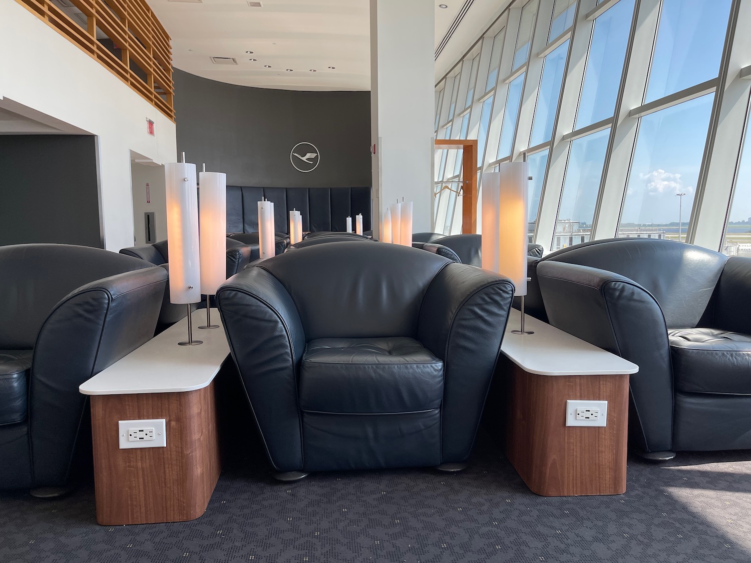 a group of chairs with candles in a room