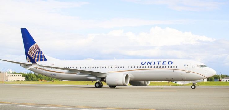 a white airplane on a runway