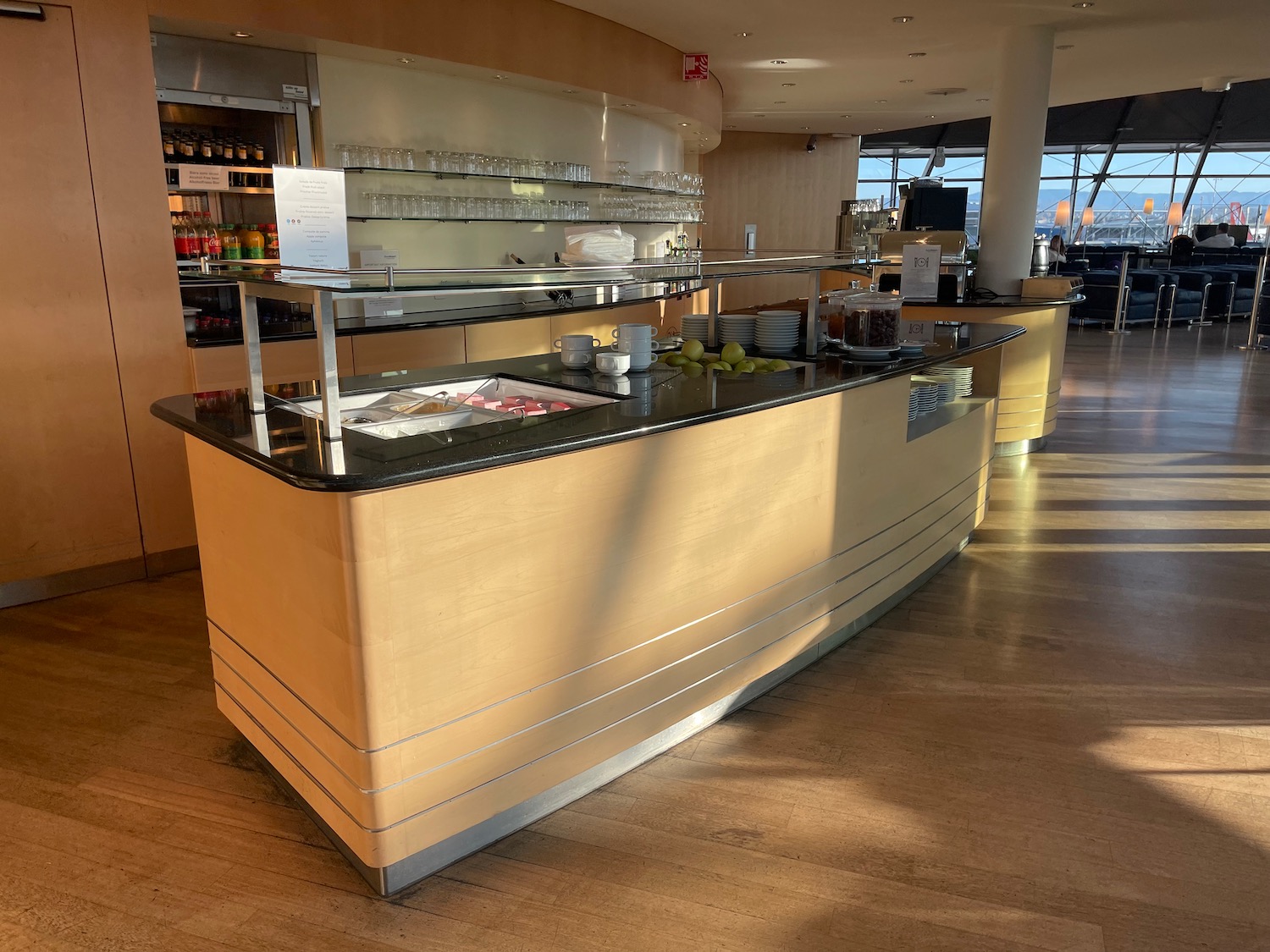 a restaurant with a counter and glasses