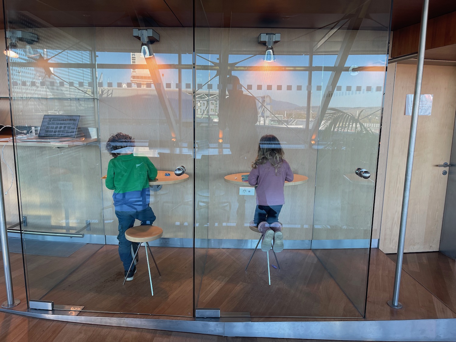 a boy and girl sitting at tables