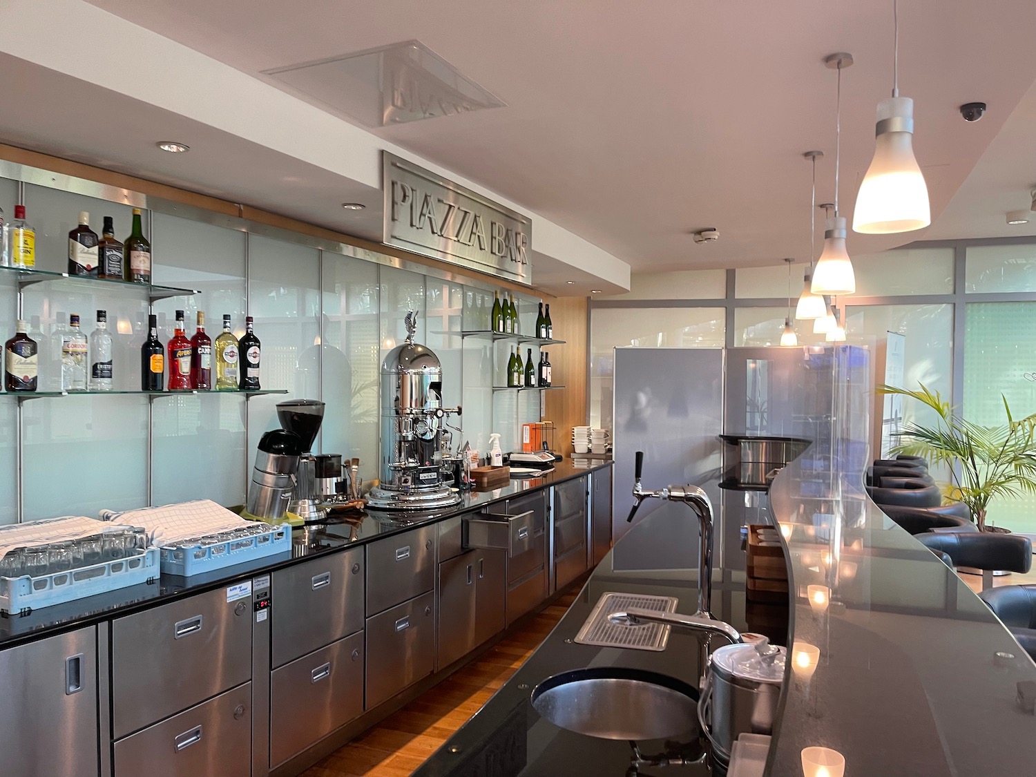 a kitchen with stainless steel appliances and bottles