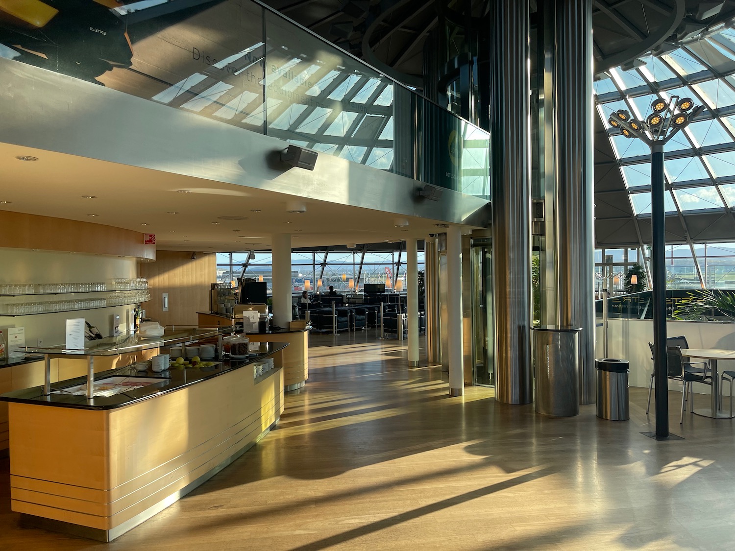 a large room with a glass ceiling and a counter