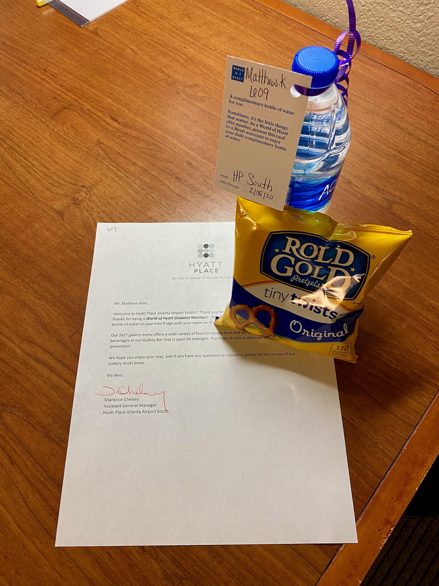 a bag of chips and a water bottle on a table