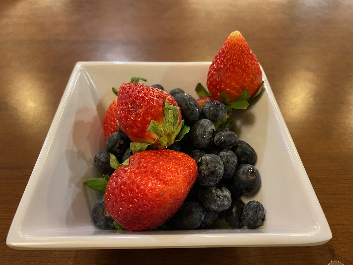 a bowl of strawberries and blueberries