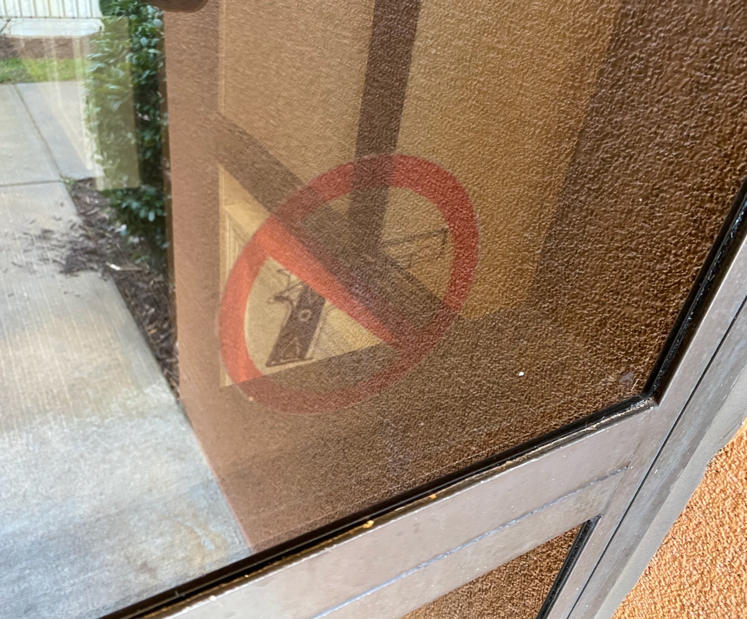 a sign on a glass door