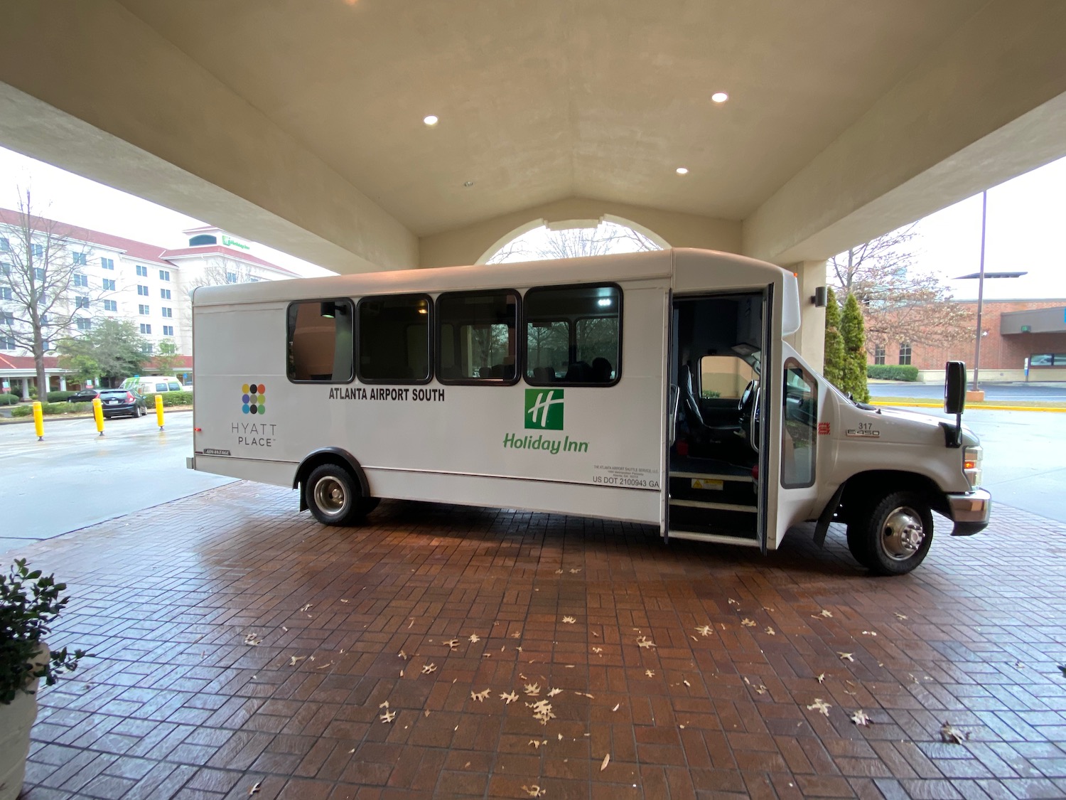 a white bus parked in a parking lot