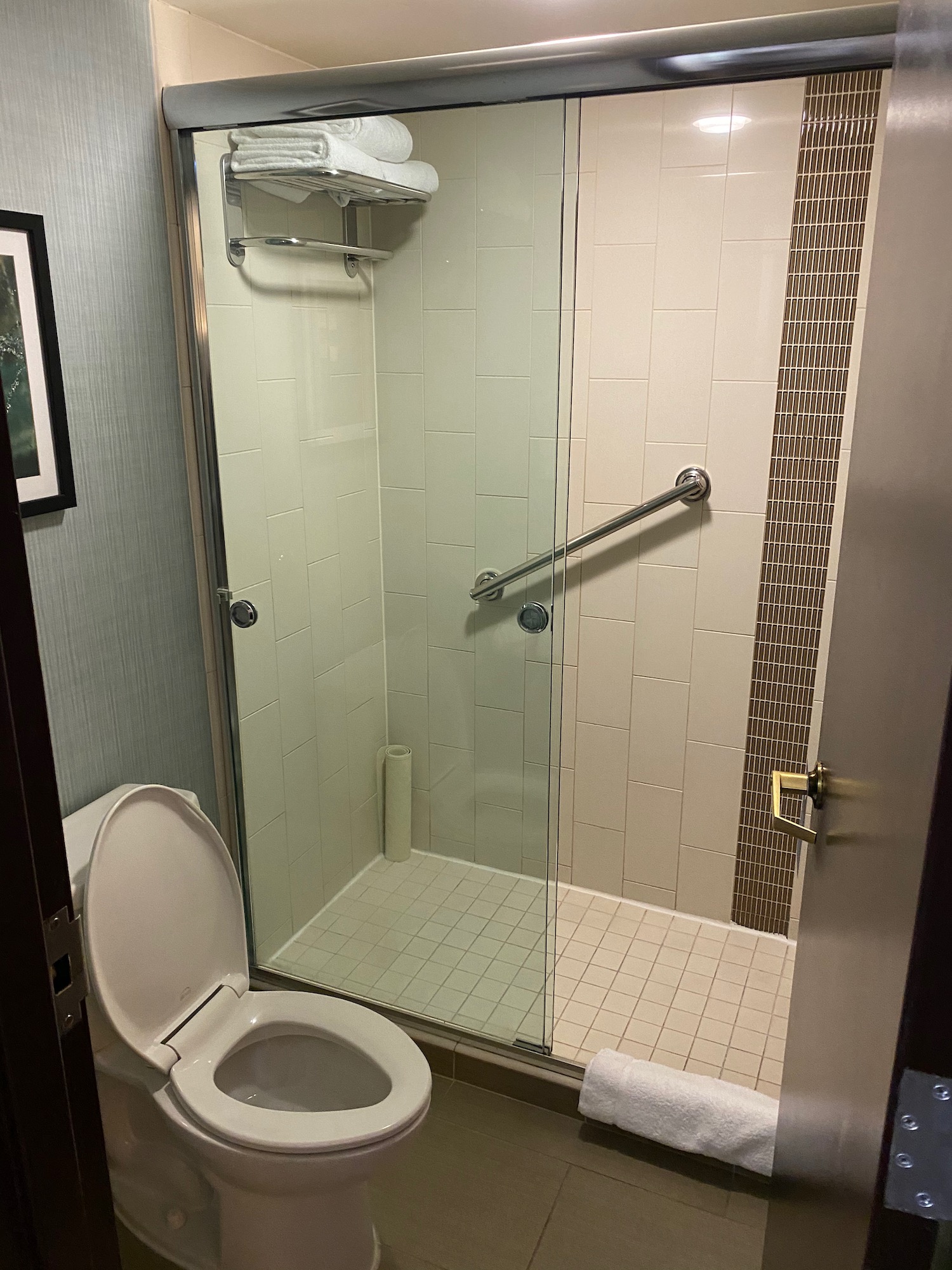 a bathroom with a glass shower door