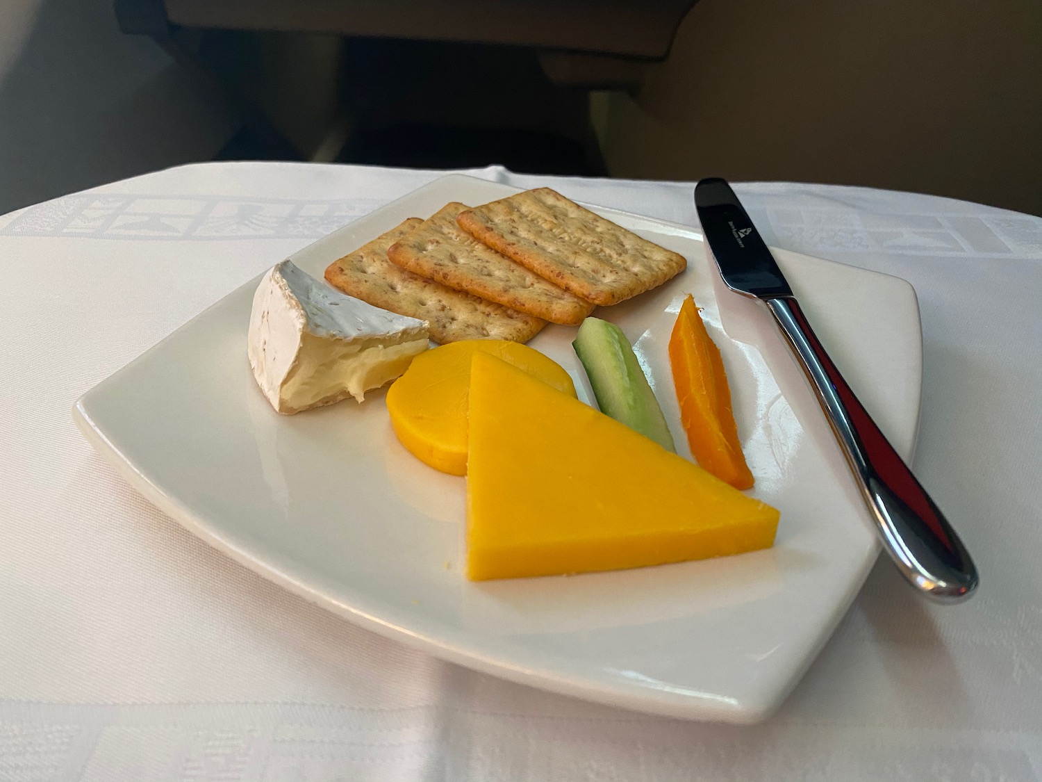 a plate of cheese and crackers