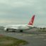 a group of airplanes on a runway