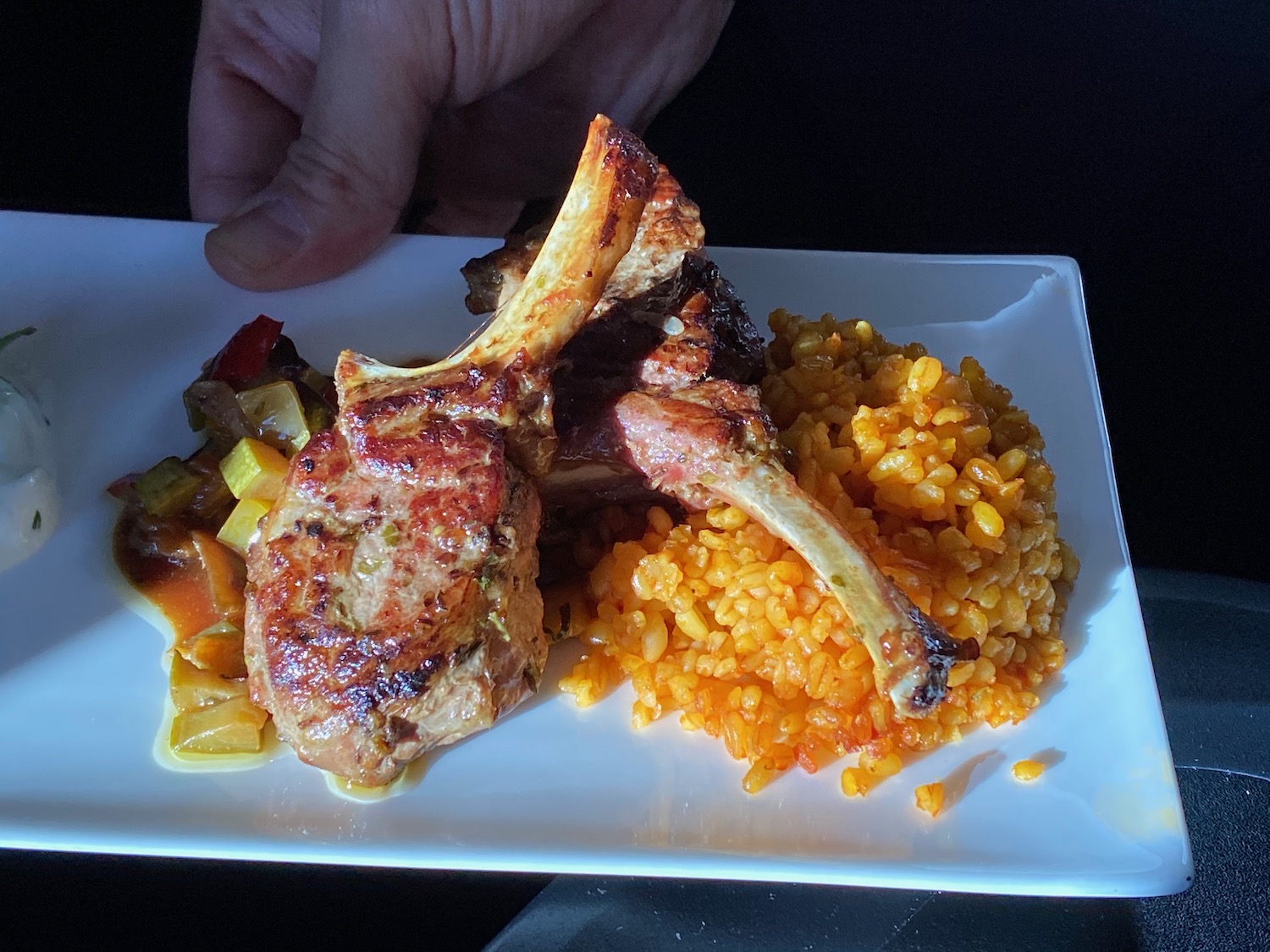 a plate of food on a black surface