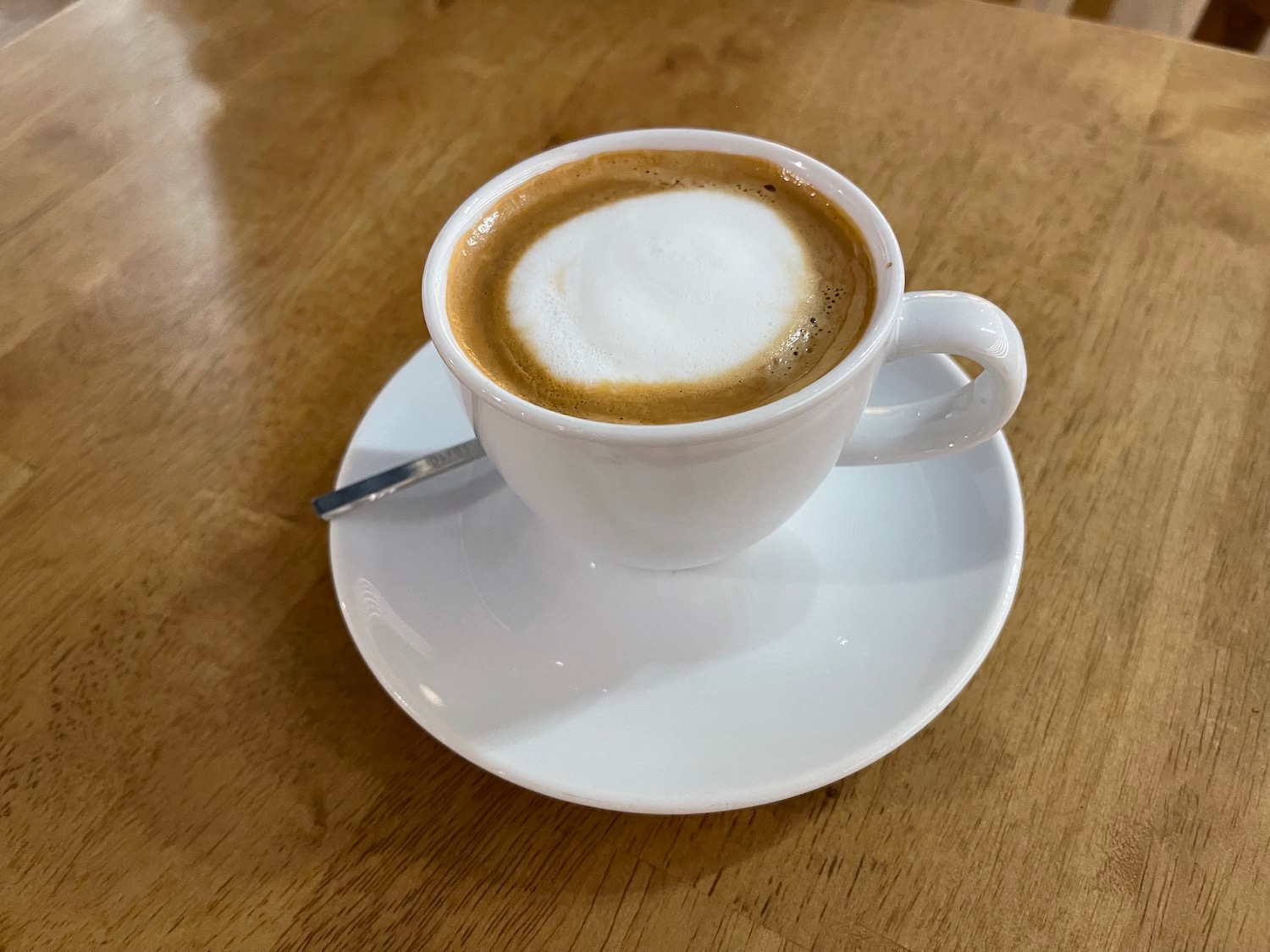 a cup of coffee on a saucer