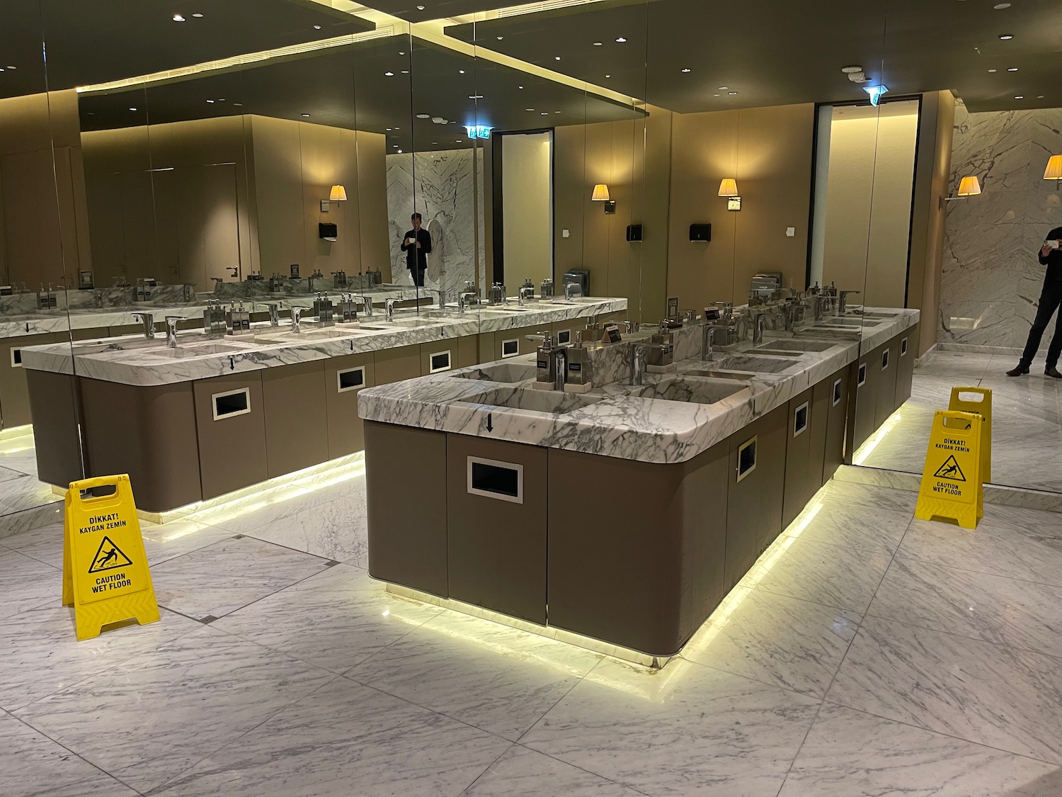 a bathroom with sinks and mirrors