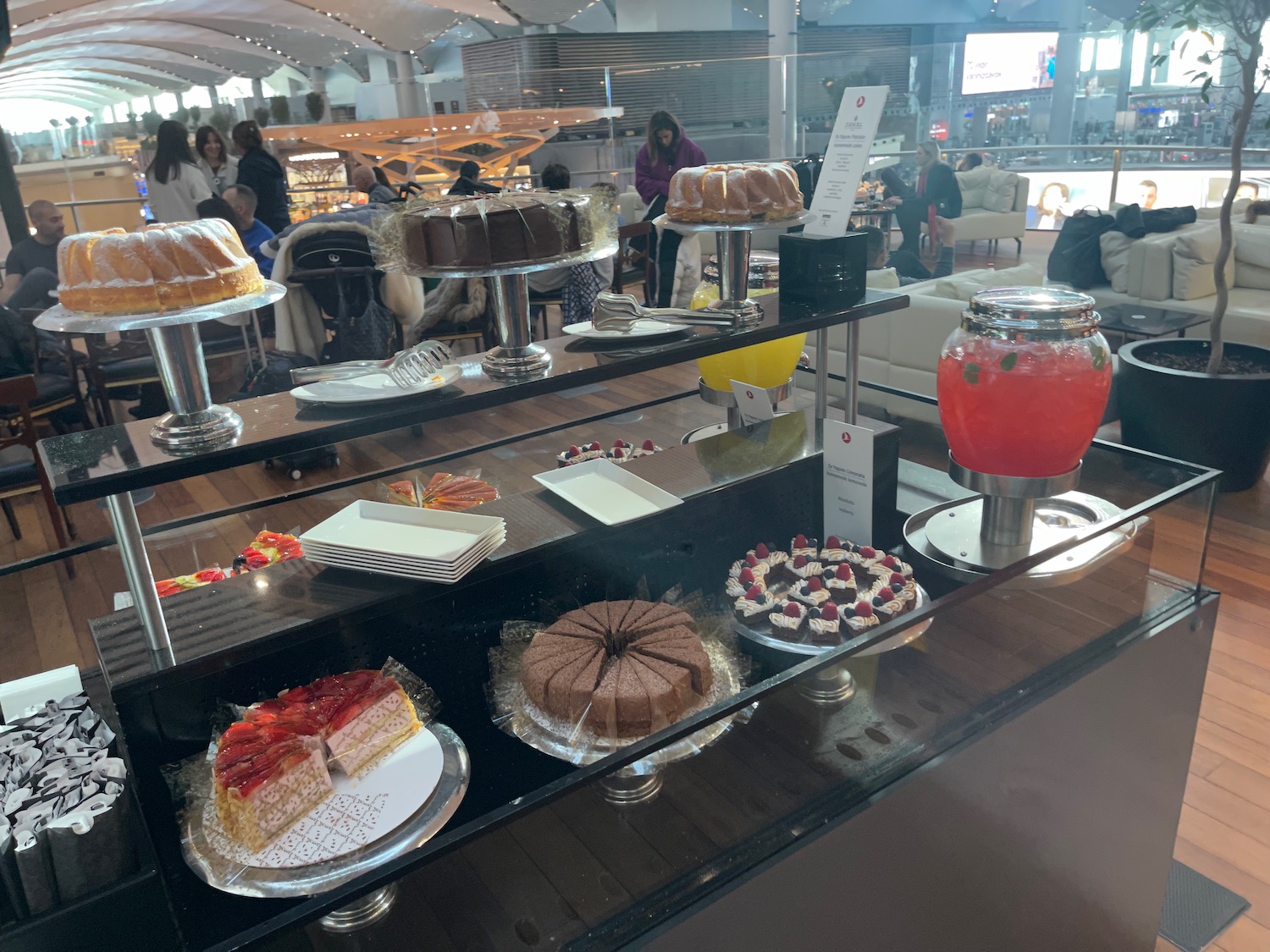 a display of cakes and desserts
