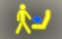 a yellow sign with a blue arrow pointing to a person walking
