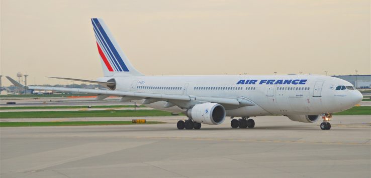 a large white airplane on a runway