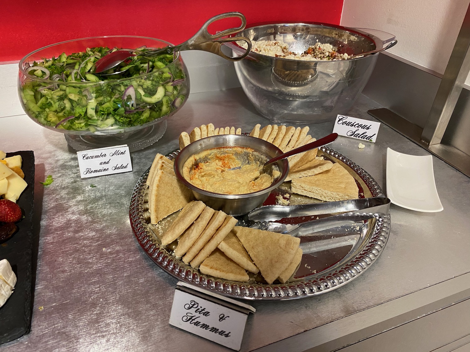 a plate of food with a bowl of salad and a bowl of food