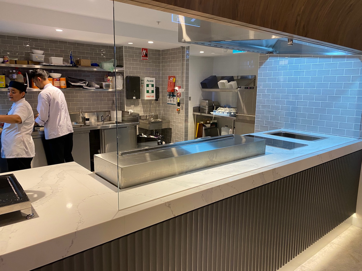 a kitchen with a glass wall