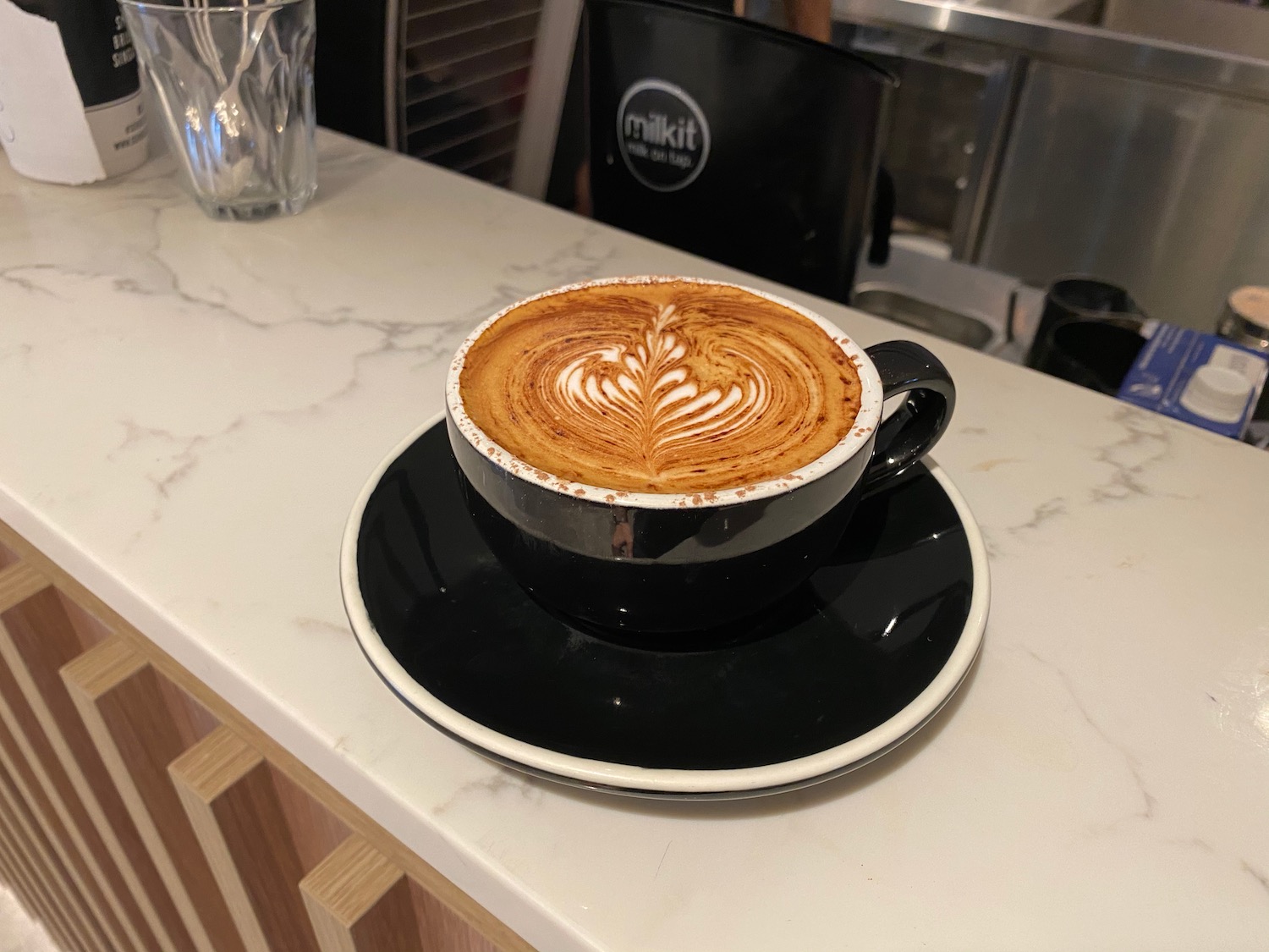 a cup of coffee on a plate