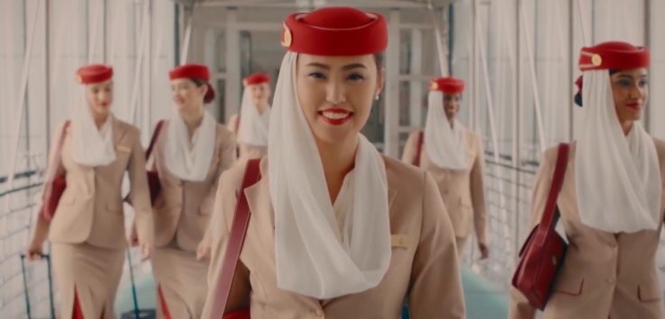 a woman wearing a red hat and white scarf